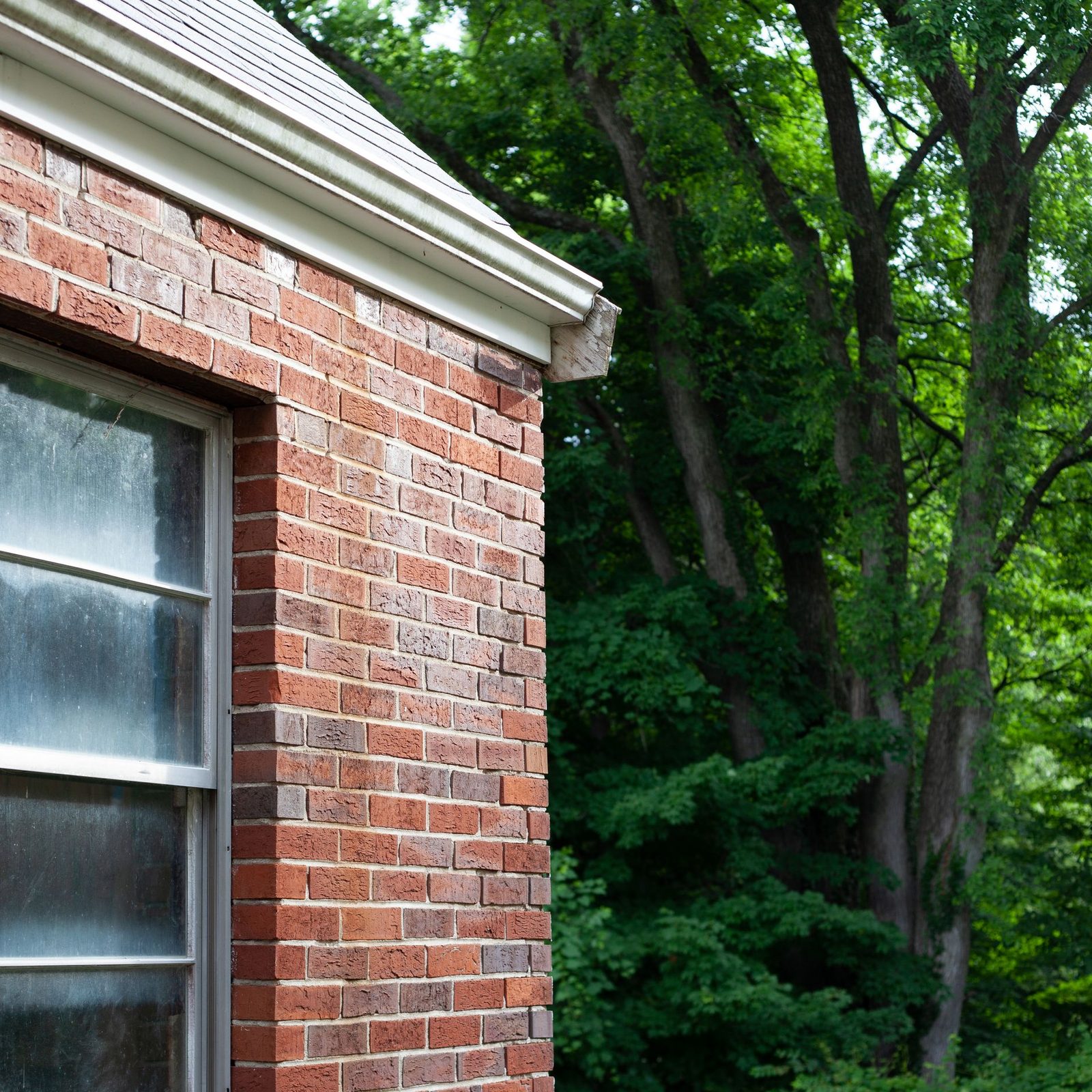 A close view of a red brick wall in running bond