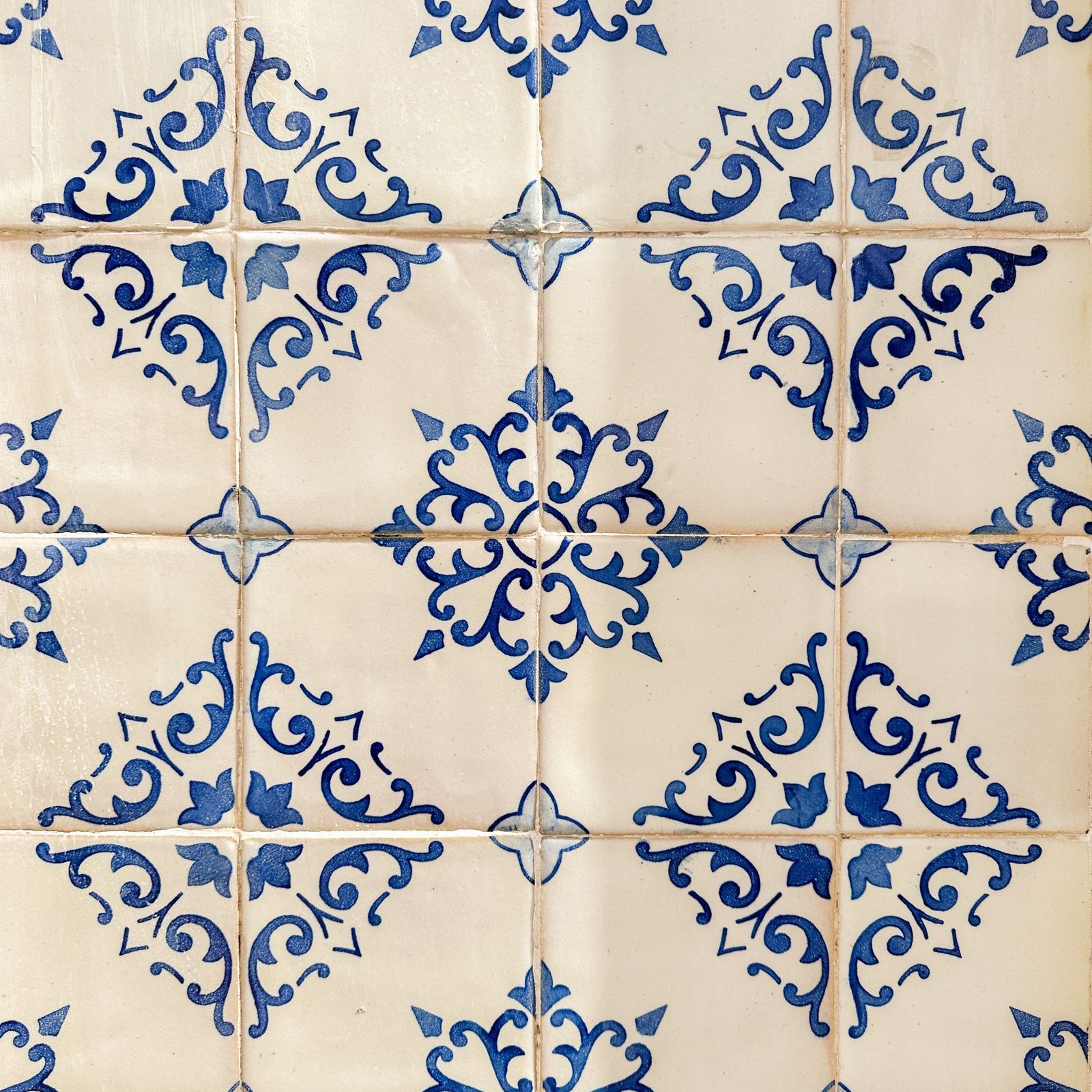 Delft-style blue and white tiles with corner motifs